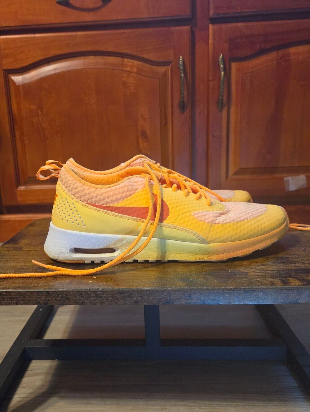 Nike Air Max Thea in a gradient orange/yellow ("Sunset" or "Laser)